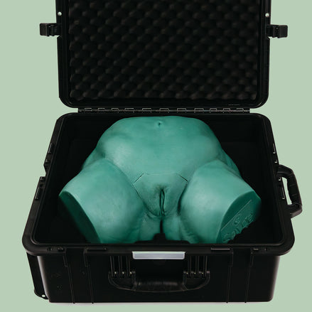 Open protective Travel Case with Sayge the wax training model inside